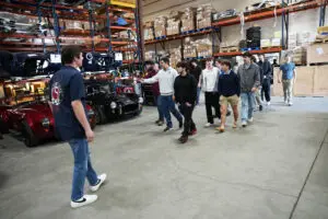 Open House attendees on the Factory Five showroom floor
