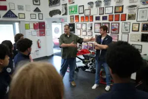 Visitors viewing Factory Five memorabilia in the showroom