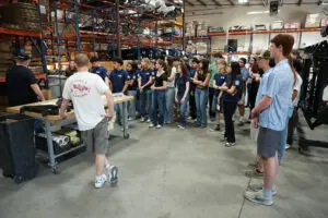Students touring Factory Five Racing assembly floor