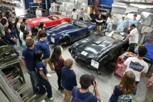 Classic Shelby Cobra roadster on display at Factory Five Racing showroom
