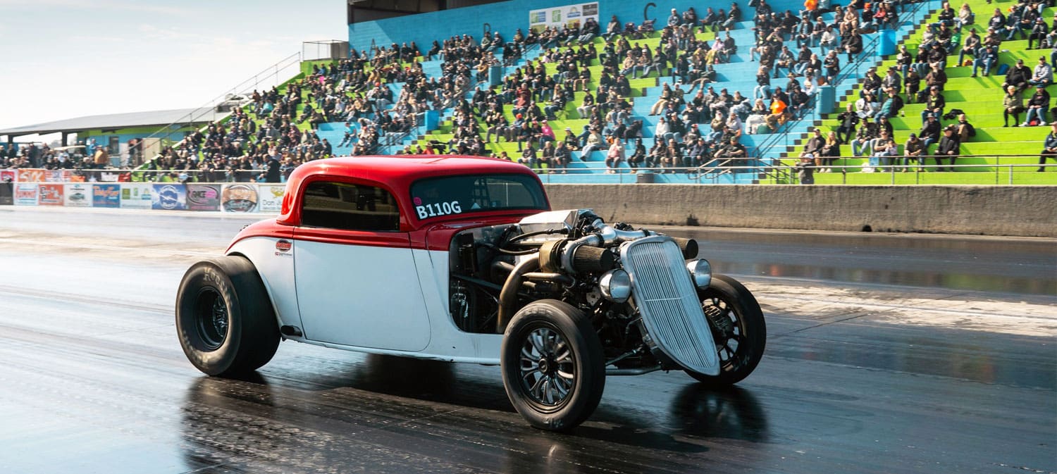 Hot rod racing on drag strip