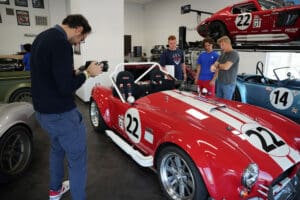 Red Factory Five Cobra race car numbered 22 on display