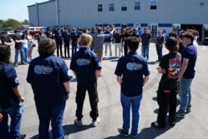 Student tour group outside Factory Five Racing headquarters