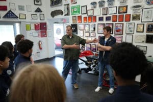 Visitors viewing Factory Five memorabilia in the showroom