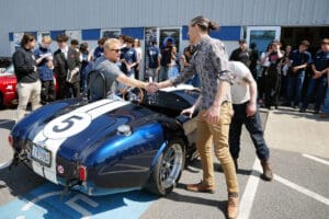 Blue Factory Five Cobra roadster with white racing stripes