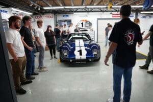 Blue and white Factory Five Type 65 Coupe race car on display