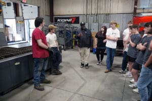 Open House attendees exploring the Factory Five showroom